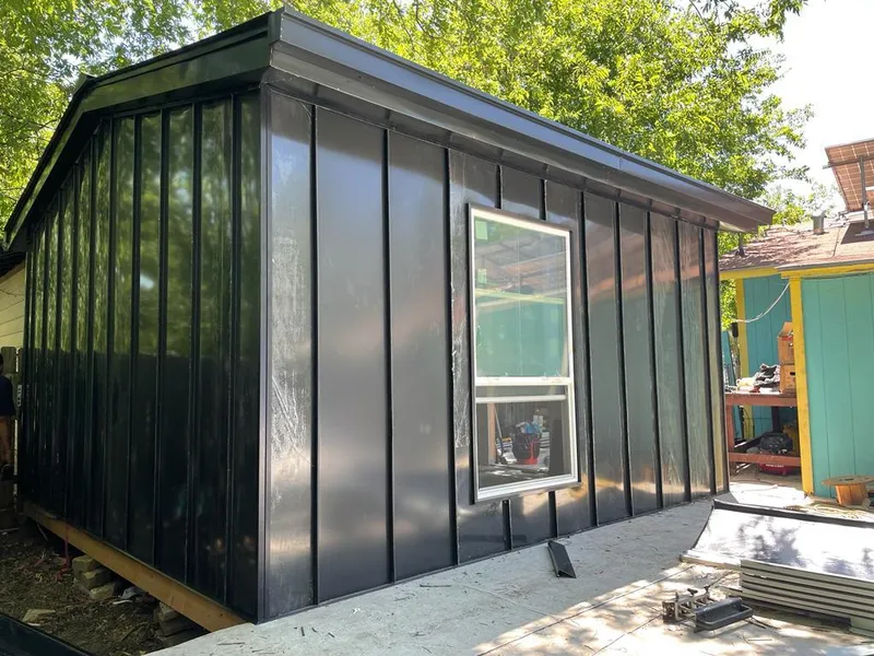 Black standing seam metal wall panels for Metal Roof Installation in Clanton