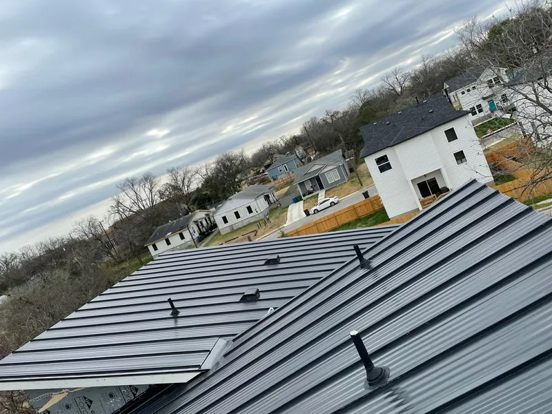 Standing seam metal roof panels with vents for Skylight Repair in Clanton